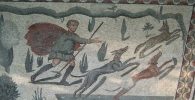 Detalle de un mosaico siciliano en el que se distinguen a dos perros cazando a lo que parece ser un zorro